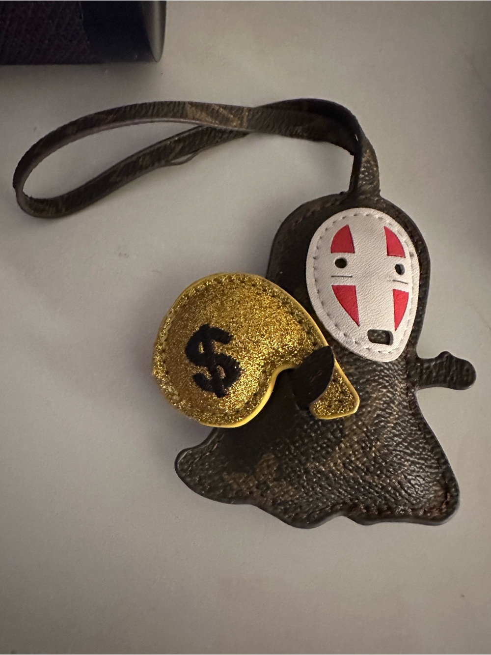 Louis Vuitton Brown Leather No-Face Character Bag Charm with money 💰 sack